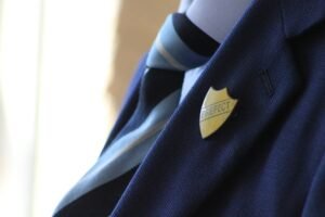prefect badge on school uniform blue blazer lapel